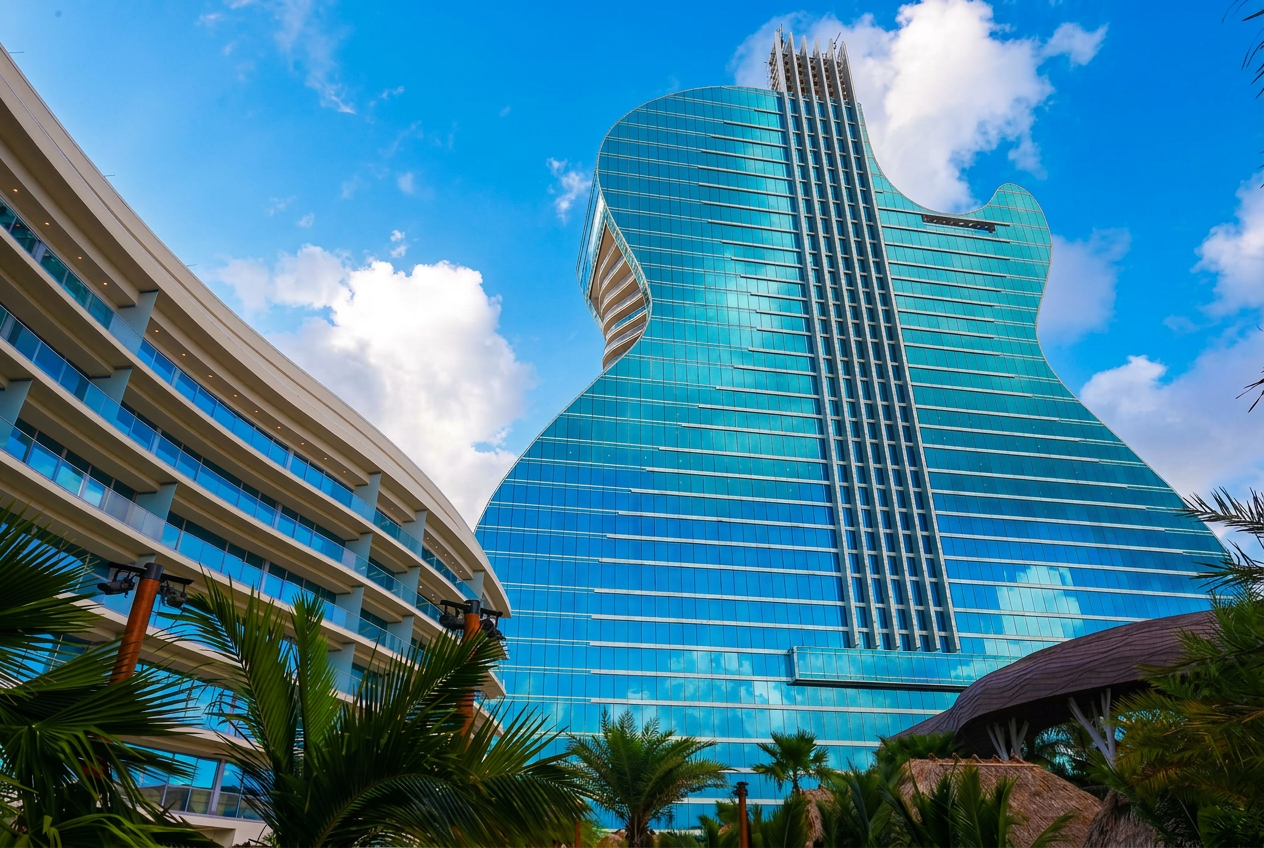 Iconic guitar-shaped hotel tower against a bright sky